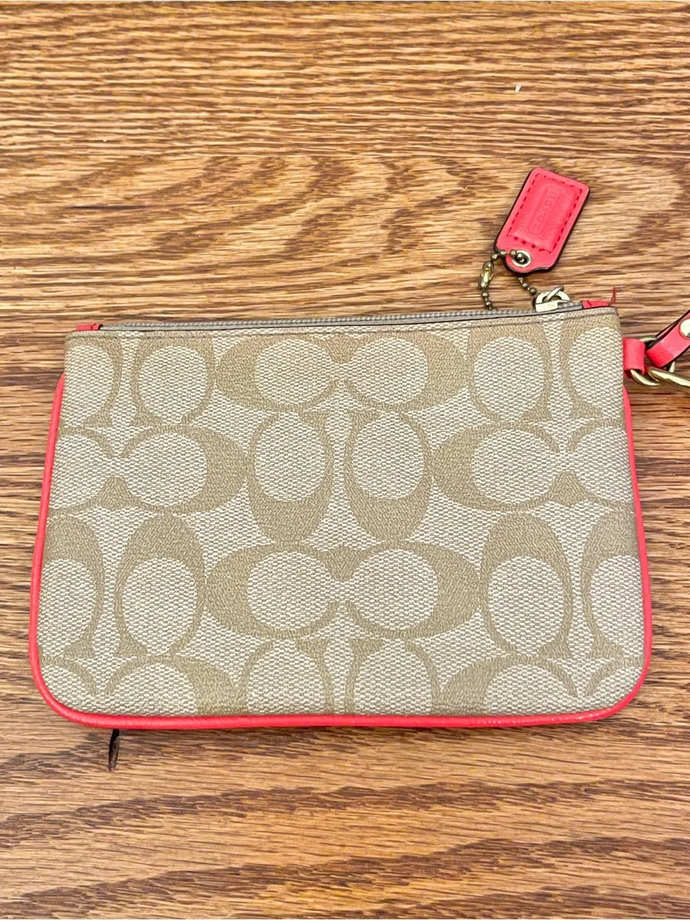 Coach Signature Canvas Wristlet with Coral Trim and Gold Hardware